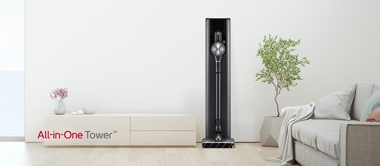 It shows a frontal shot of A9 All-in-One Tower in a white tone modern living room interior.