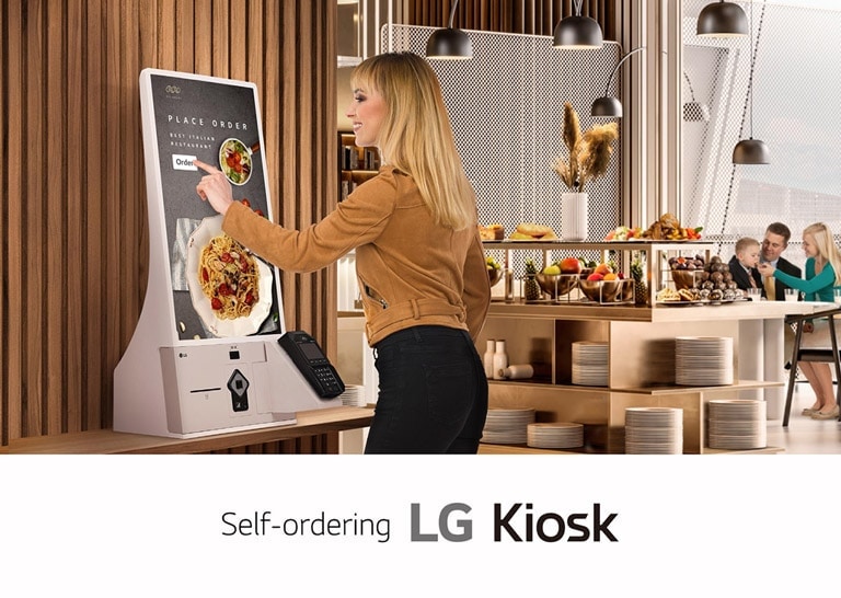 A large display is installed on a shopping mall’s interior wall, and the display’s screen is showing advertisements clearly and vibrantly.