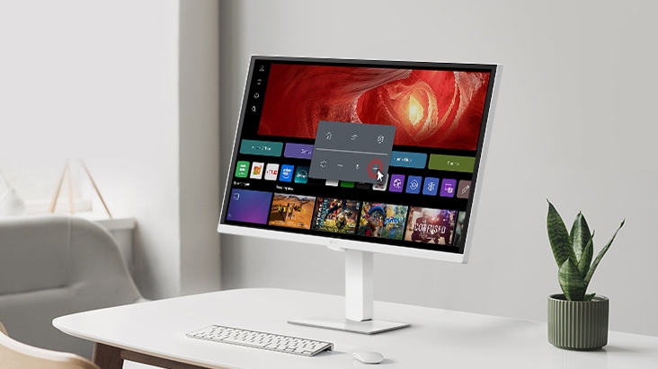 The LG Smart Monitor Swing screen shows the webOS interface, and the volume is being turned up.