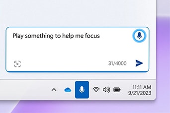 The image shows a digital assistant input box where the user types, "Play something to help me focus." It’s part of a Windows taskbar interface, with standard system icons below, indicating a request for focus music.
