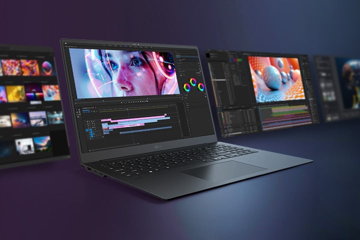 A sleek laptop is showcased with a vibrant video editing interface on its screen, surrounded by additional screens displaying various creative workflows.
