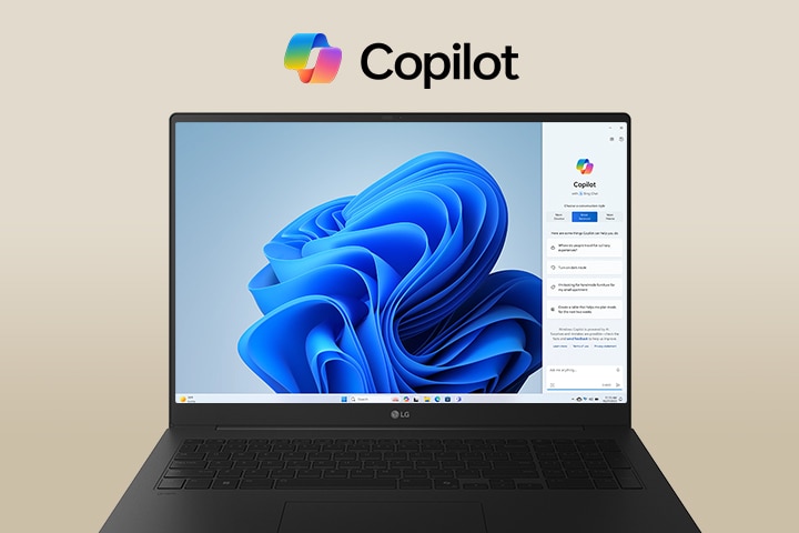 A laptop featuring the Windows Copilot logo above the screen and Windows Copilot interface on the display, showcasing a sleek design with a large screen and the Windows 11 interface in the background.