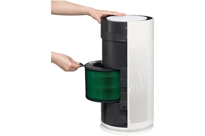 Pulling the filter forward to remove it from an LG air purifier