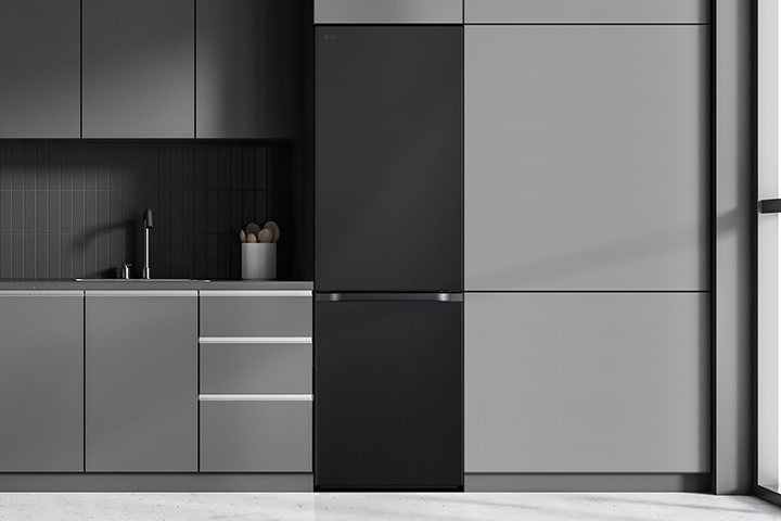 Modern kitchen with a refrigerator that blends seamlessly into surrounding cabinetry, resembling a built-in model.