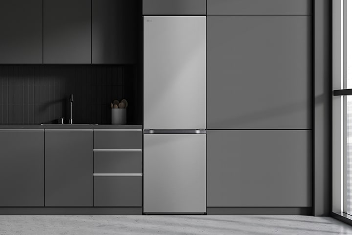 Modern kitchen with a refrigerator that blends seamlessly into surrounding cabinetry, resembling a built-in model.