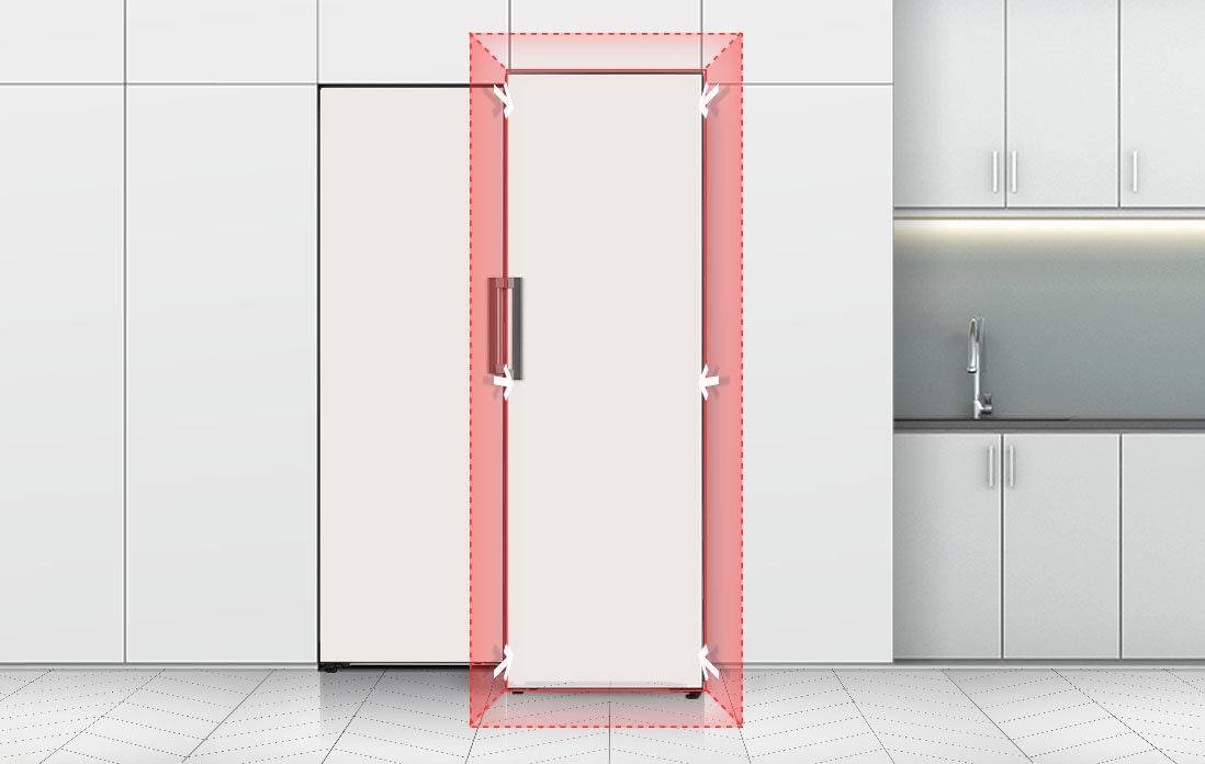 Front view of refrigerator fitted seamlessly into a kitchen space, next to a kitchen sink.