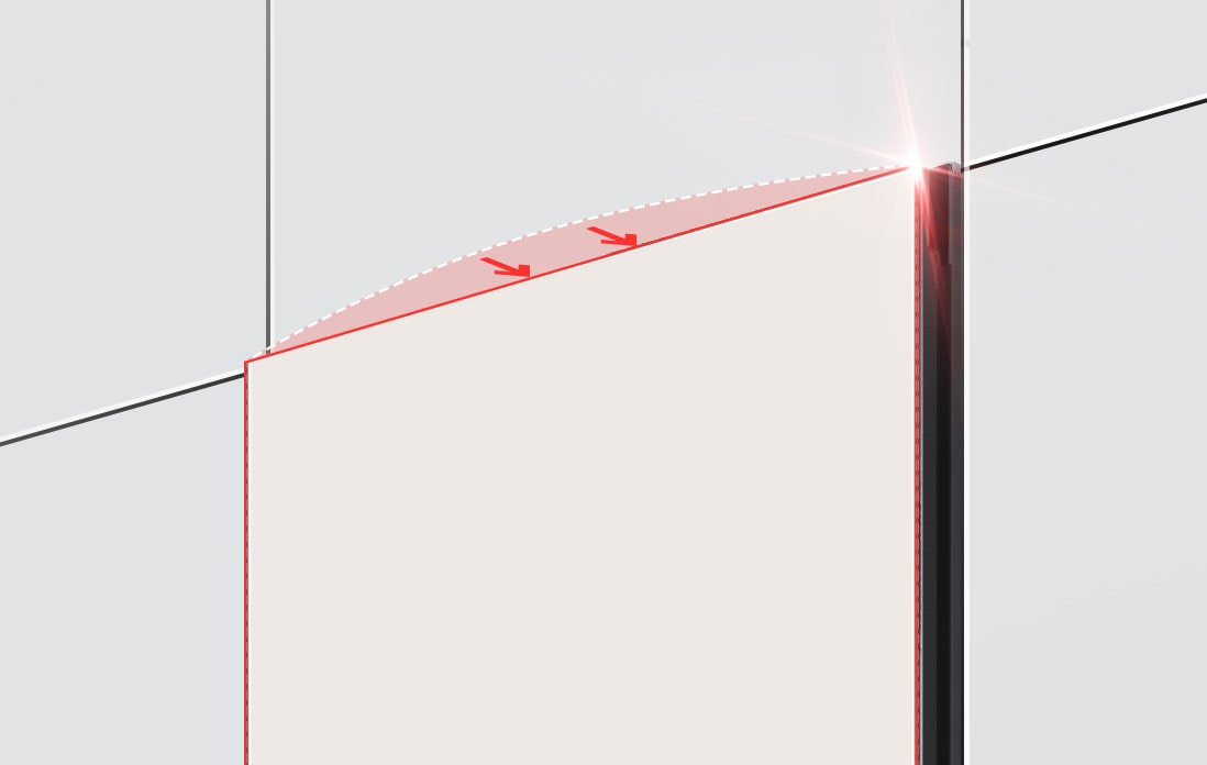 The top of the refrigerator is shown at an angle with two arrows pointing in toward the wall at the top edge indicating the refrigerator is flush with the cabinets surrounding it.