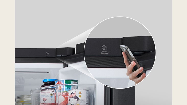 A person checking the refrigerator status using a smartphone with the lg smart diagnosis feature enabled.