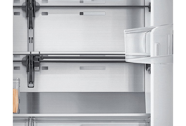 image shows how folding shelf is operated. By simply sliding it back, more space is created to store tall bottles.