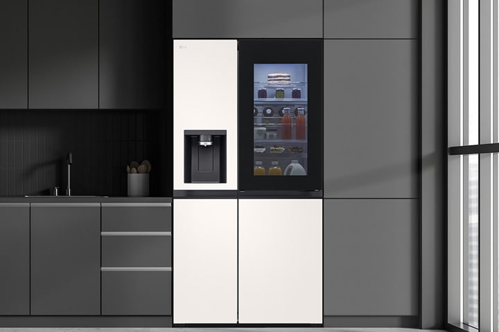 Modern kitchen with a refrigerator that blends seamlessly into surrounding cabinetry, resembling a built-in model.