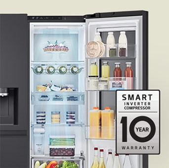 Fresh food-filled refrigerator with open door and 10-year warranty label of smart inverter compressor.