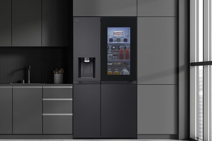 Modern kitchen with a refrigerator that blends seamlessly into surrounding cabinetry, resembling a built-in model.