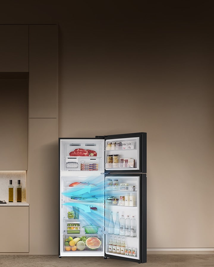 Modern kitchen with open LG refrigerator, showing fresh food, drinks, and even airflow technology on the right.