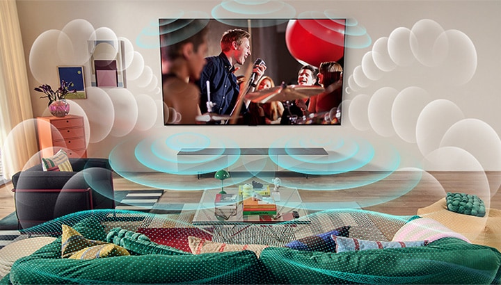 An image of an LG OLED TV in a room showing a music concert. Bubbles depicting virtual surround sound fill the space.