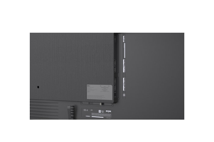 LG Micro RGB evo AI MRGB95 is seamlessly wall-mounted in a spacious black-toned room, displaying bold artwork in vivid colors that harmonize with the surrounding interior.