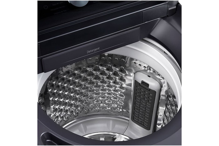 Woman unloading laundry from a top loading washing machine, featuring EasyUnload™.