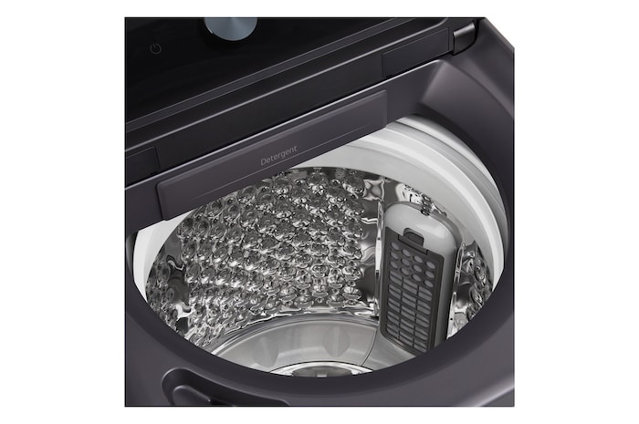 Woman unloading laundry from a top loading washing machine, featuring EasyUnload™.