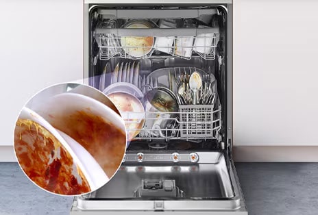 LG freestanding dishwasher with the door fully open, revealing dishes before being washed.	