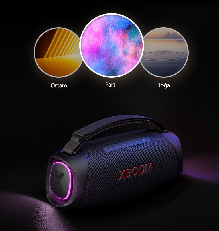 LG XBOOM Go XG8T, mor ışıklandırma açık halde zemine yerleştirilmiştir. Hoparlörün üstünde Light Studio'nun üç modu gösterilir: ortam, doğa ve parti.