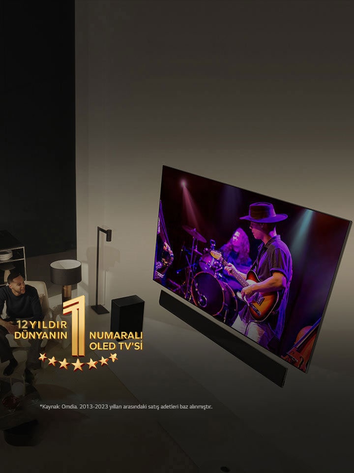 Modern bir dairede geniş ekran OLED TV’de konser seyreden bir adam ile kadının tepeden görünümü. Görüntüde “11 Yıldır Dünyanın 1 Numaralı OLED TV’si” amblemi yer alıyor. Bir sorumluluk reddi ekranda görünür: “Kaynak: Omdia. Birim sevkiyatları, 2013 - 2023. Sonuçlar, LG Electronics tarafından onaylandığı anlamına gelmemektedir. Sonuçlara güvenilmesi üçüncü tarafın kendi sorumluluğundadır. Daha fazla detay için https://www.omdia.com/ adresini ziyaret edin.”