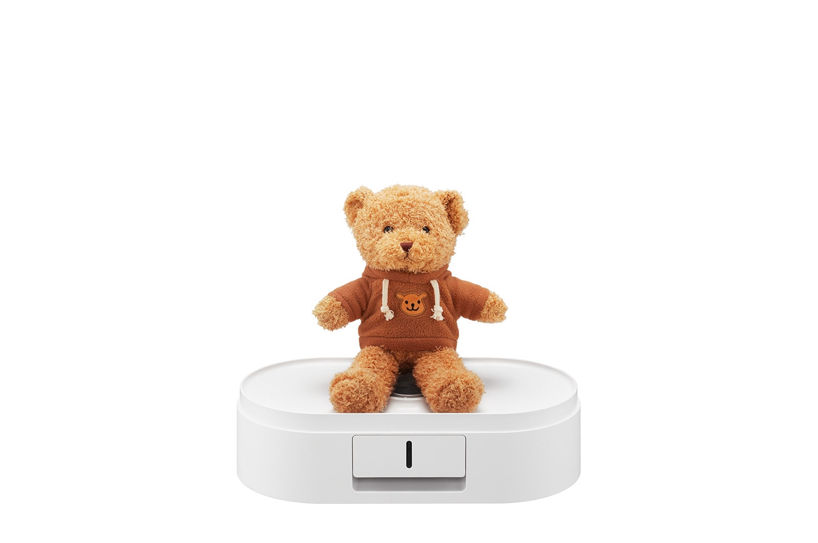 泰迪熊放置在打開的烘物箱