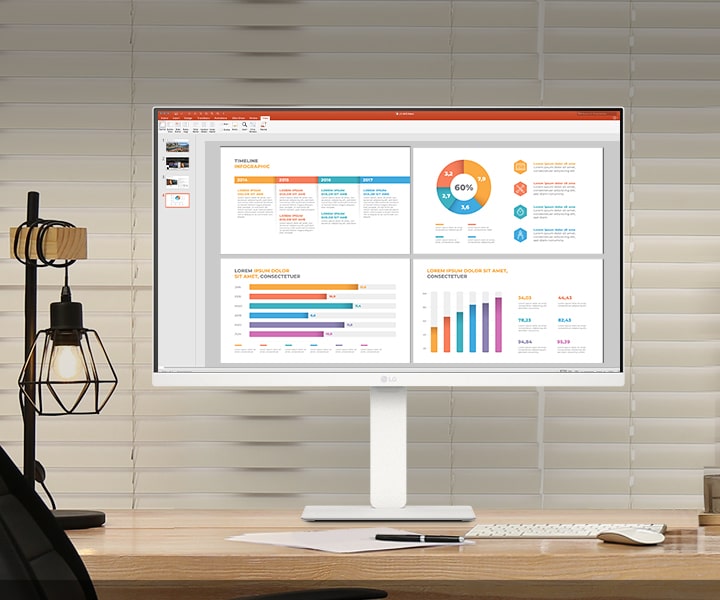圖片展示桌子上放著一台 LG Smart Monitor,螢幕上顯示著工作和遊戲內容。