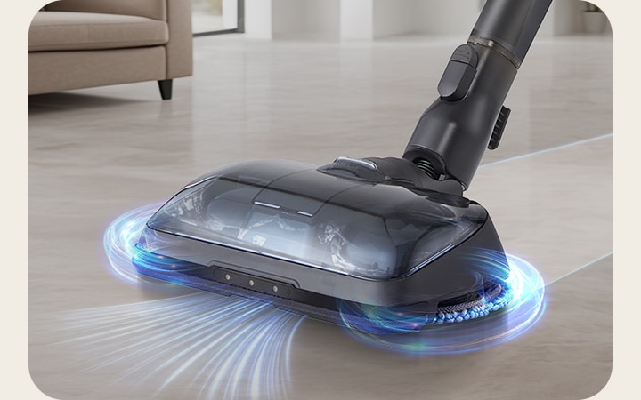 LG a9k-legend3 吸塵器的 Power Drive 強勁濕拖吸頭正在清潔硬木地板，配備兩片旋轉濕拖布和強勁吸力。