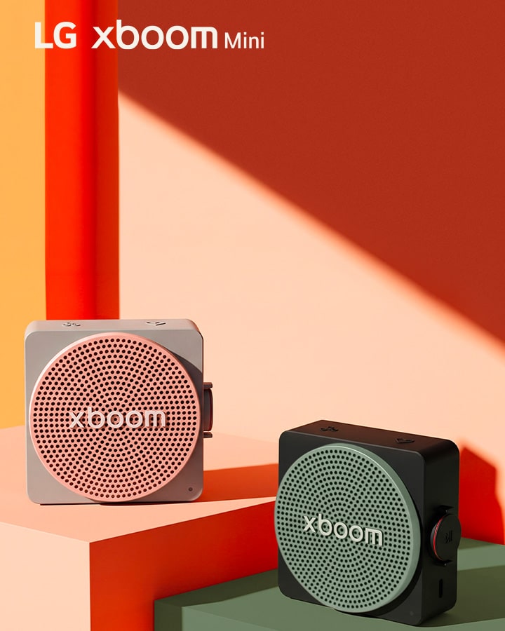 LG xboom Mini with interchangeable color grilles in pink and green.