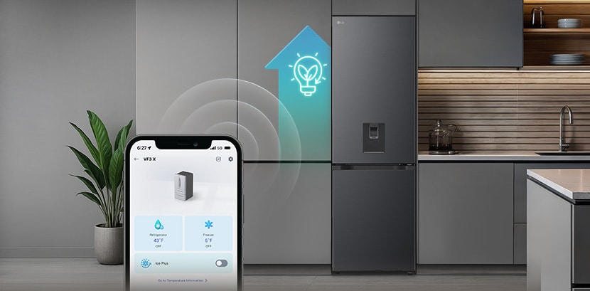 LG bottom freezer (GBFSJ10DEP) in a grey kitchen with a smartphone showing the LG ThinQ app and a teal energy saving icon