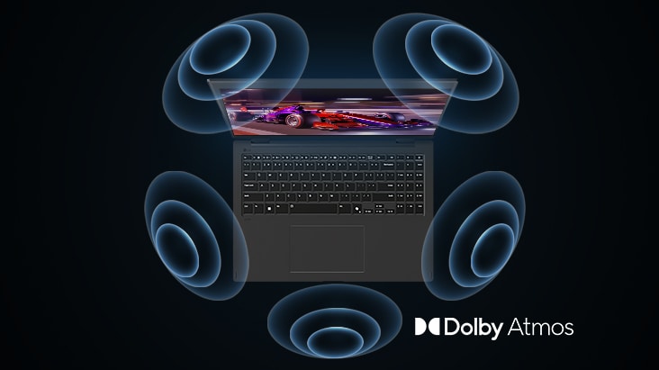 'The image shows a top-down view of a laptop with a vibrant, purple-themed graphic on the screen. Surrounding the laptop are dynamic sound wave visuals, indicating an immersive audio experience. The "Dolby Atmos" logo is displayed in the bottom right corner.