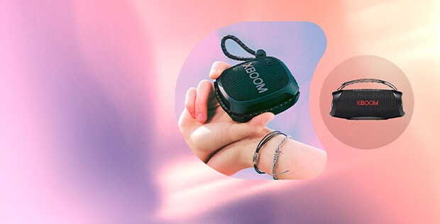 two lg xboom portable speakers on a pastel background with which award logo 