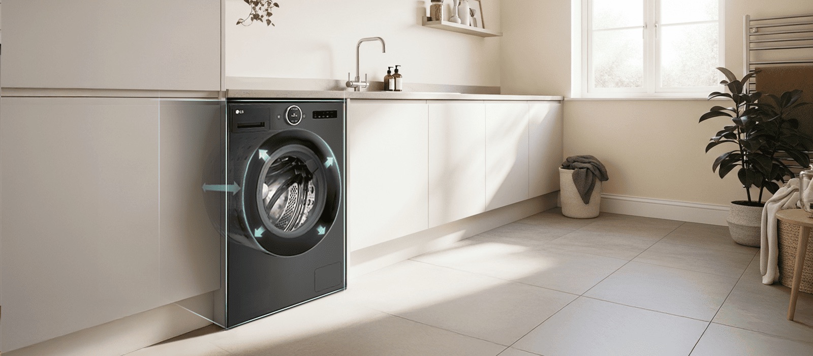 LG front load washing machine built into kitchen cabinetry. Arrows point outward from the drum to indicate size. A modern living room is visible next to the kitchen.