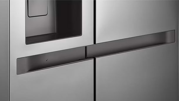 A close-up of a modern LG refrigerator’s stainless steel door and handle design