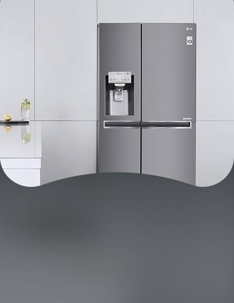 LG side-by-side fridge freezer with dispenser in a white built-in kitchen