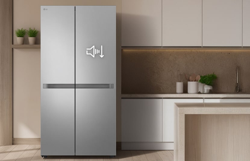 LG refrigerator with a sleek silver finish standing in a modern kitchen, showing a sound-reduction icon on the door.