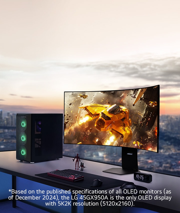 LG UltraGear 45GX950A, the world’s first 5K2K curved OLED gaming monitor, displayed on a desk with a gaming PC and accessories, showing a vivid space battle scene on screen.