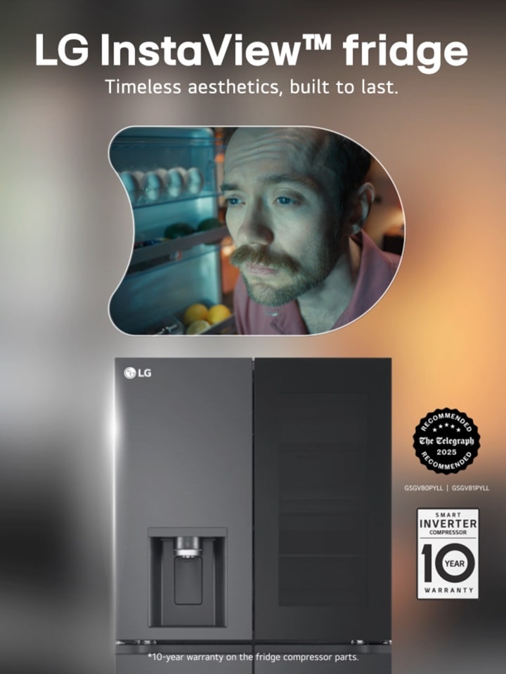 A man is looking into an LG InstaView Fridge 