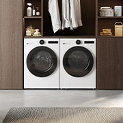 A lifestyle image showing the white LG RHX7010TWB 10kg DUAL Inverter Heat Pump Dryer beside a matching washer in a cozy, earth‑toned setting.
