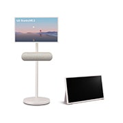 LG StanbyME 2 screens displayed in a modern living room. There is a StanbyME 2 on a stand, one is hung on the wall, and the other is propped up on a table using the folio cover.