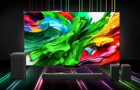 LG 100QNED86A6 TV displaying a bright, colourful screen, with the LG US40TR soundbar positioned in front and to the side, set against a black background with green and pink LED lighting