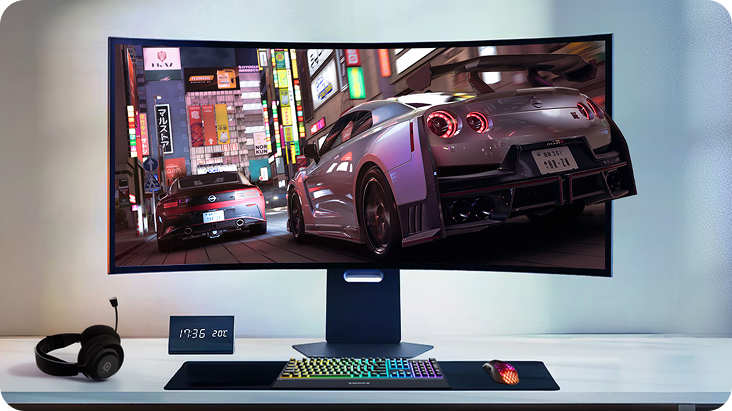 LG Ultragear monitor standing on a light desktop with a clock, headphones and a keyboard and a mouse