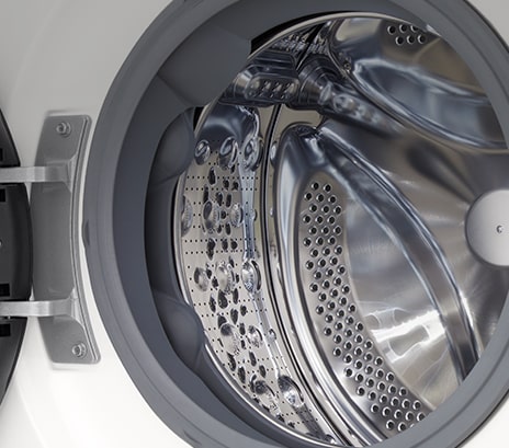 Close-up of the washing machine drum with the door open	