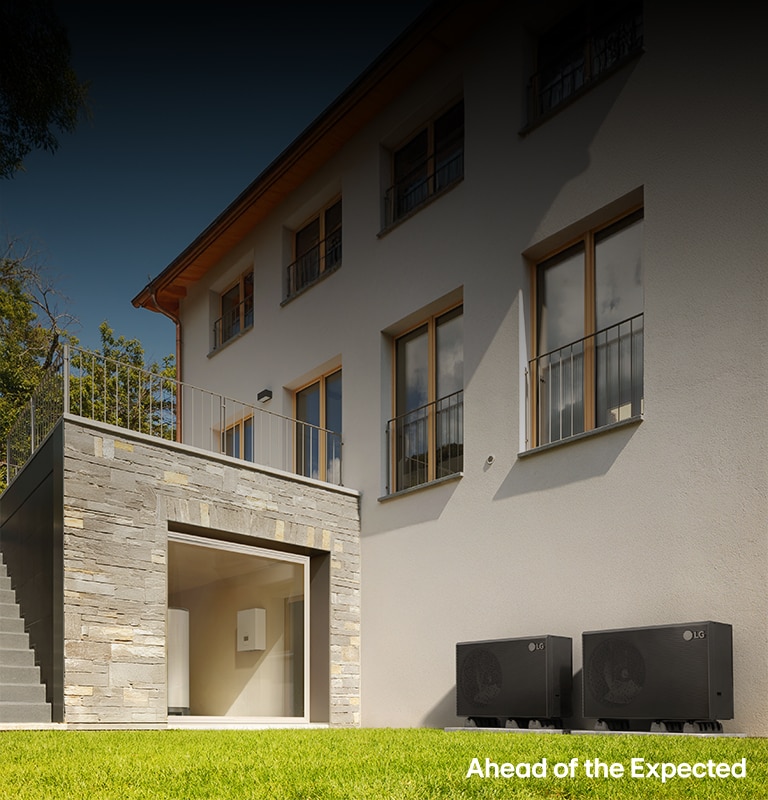 LG HVAC system setup with outdoor and indoor units, plus a wall-mounted control panel in a modern stone house.	