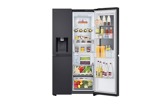 A black side-by-side refrigerator with the door open, showing shelves and drawers filled with drinks, dairy items, desserts, and vegetables.
