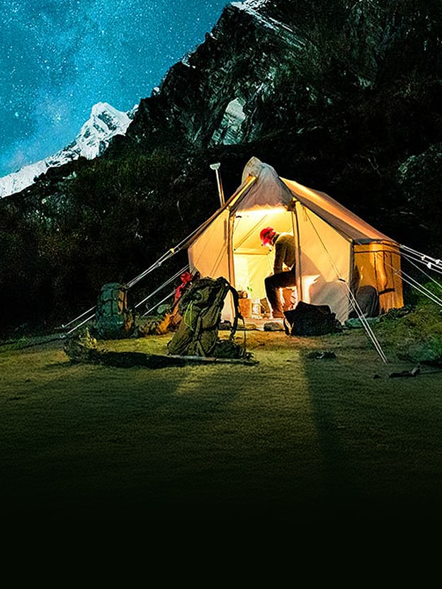 LG TV showing a gridded night sky and a lit tent illustrates Dynamic Tone Mapping refining imagery by enhancing contrast, mid-tones, and bright details.