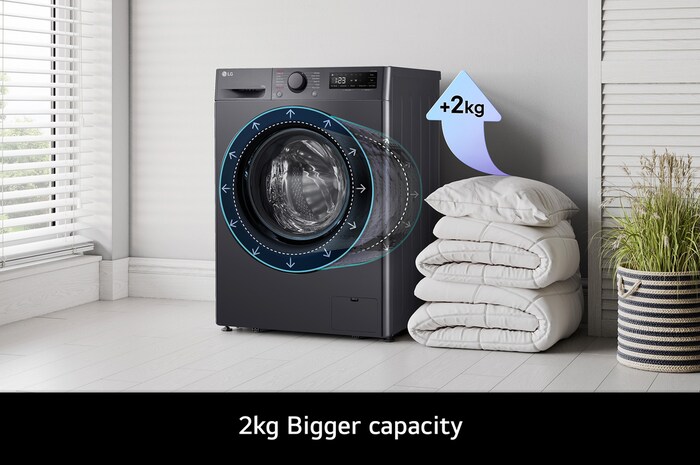 The LG F4Y510GBLN1 washing machine in Slate Grey, highlighting its bigger 10kg capacity in the same standard-sized drum.