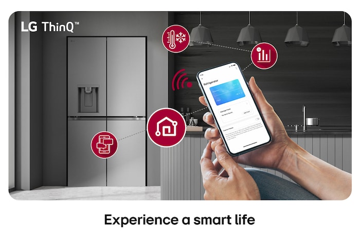 LG Multi-Door Refrigerator GML960PYFE in a silver finish, controlled remotely by hands adjusting the settings via the LG ThinQ™ application on a smartphone.