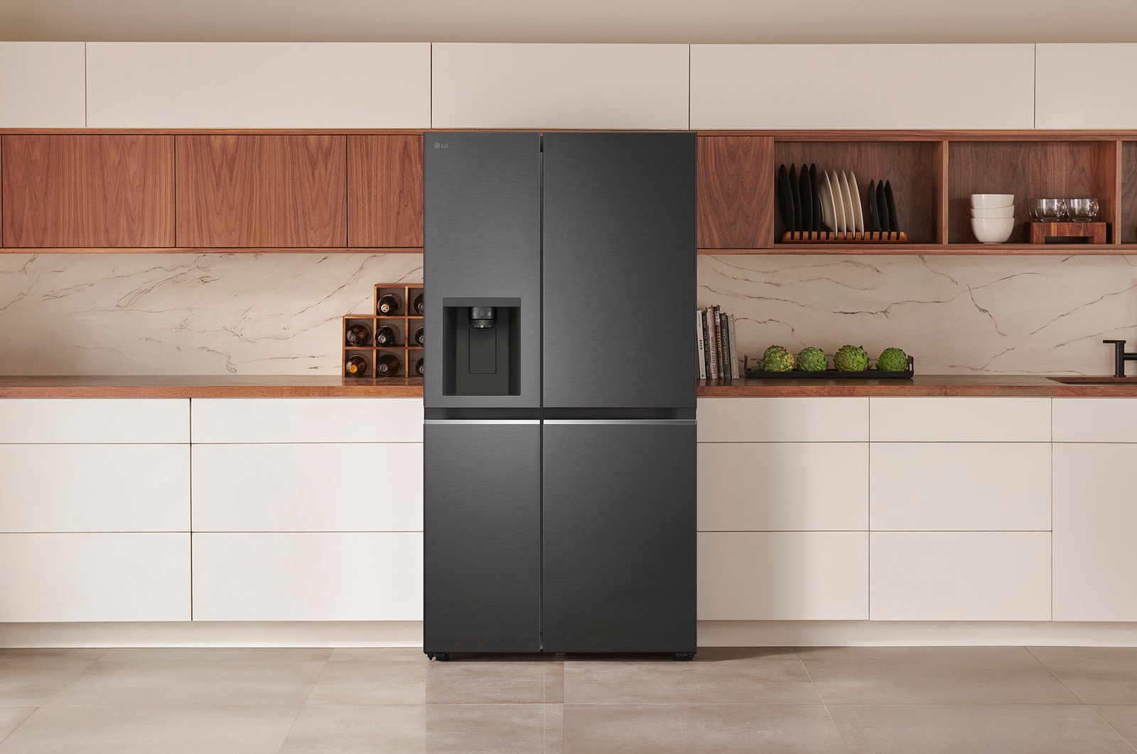 LG Side-by-Side Refrigerator GSLV71MCTD in a matte black steel finish, seamlessly integrated into a modern kitchen with white and wood cabinets, featuring an external water dispenser.