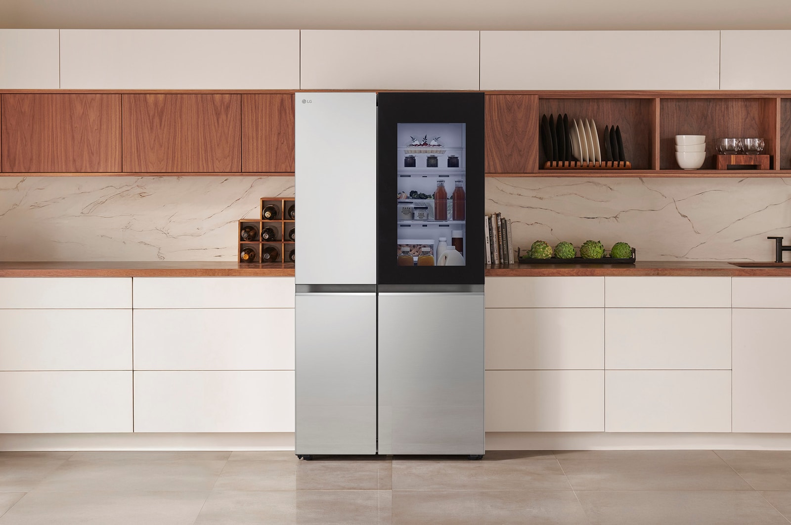LG Side-by-Side Refrigerator GSVV80PYLL in a stainless steel finish, featuring InstaView™ Door-in-Door®, seamlessly integrated into a modern kitchen with white and wood cabinets.