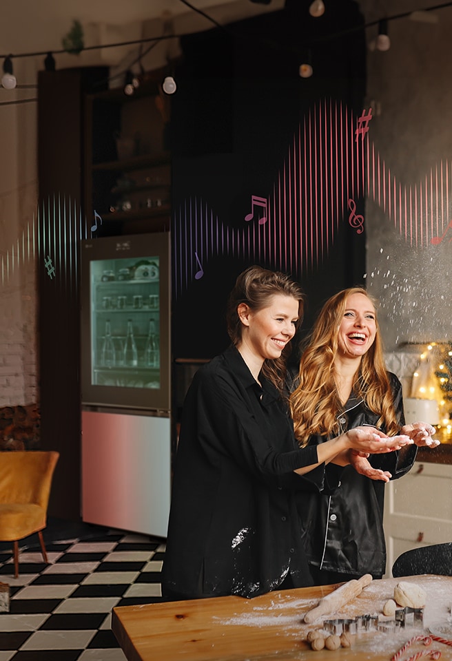 The images of two women as if they were partying in the kitchen and a glowing refrigerator image.